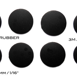 May include: Six black round silicone rubber pads with 3M adhesive backing. The pads are 1 1/16 inches in diameter and 1/16 inch thick. The text "17.8MM" and "SILICONE RUBBER" are printed on the top row of pads. The text "11/16" and "3M ADHESIVE" are printed on the top row of pads. The text "HEIGHT 1.5MM/1/16" and "RB276" are printed on the bottom row of pads.