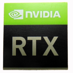 May include: A black and green sticker with the NVIDIA logo and the text "RTX" in silver lettering.