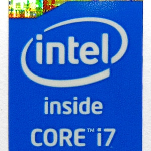 May include: A blue sticker with the Intel logo and the text "inside CORE™ i7"
