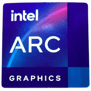 May include: A square sticker with a gradient blue background and the Intel logo in white at the top. Below the logo, the word "ARC" is in large white letters, and "GRAPHICS" is at the bottom.