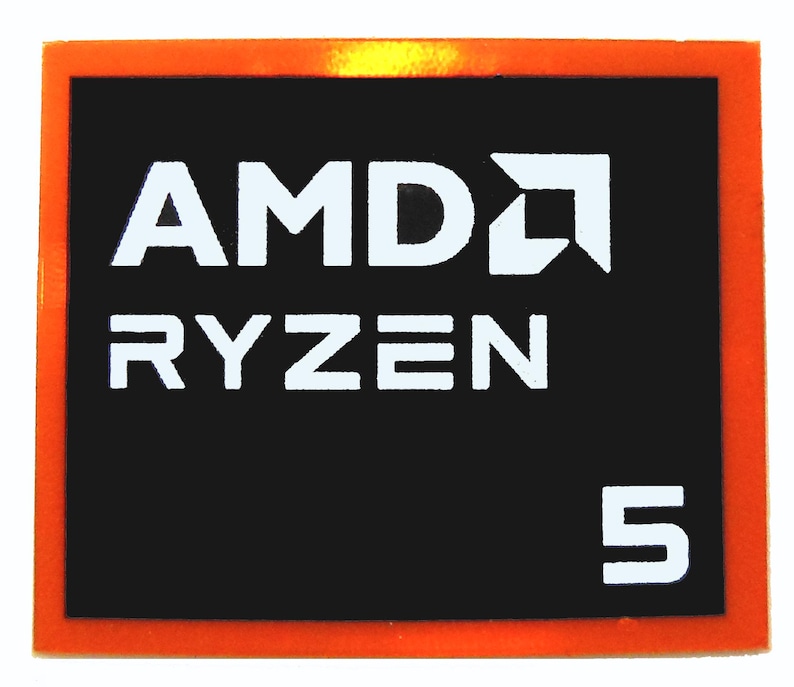 May include: A rectangular sticker with an orange border and a black interior. The white text reads "AMD RYZEN 5". The AMD logo is also white and is located to the right of the "D" in AMD.
