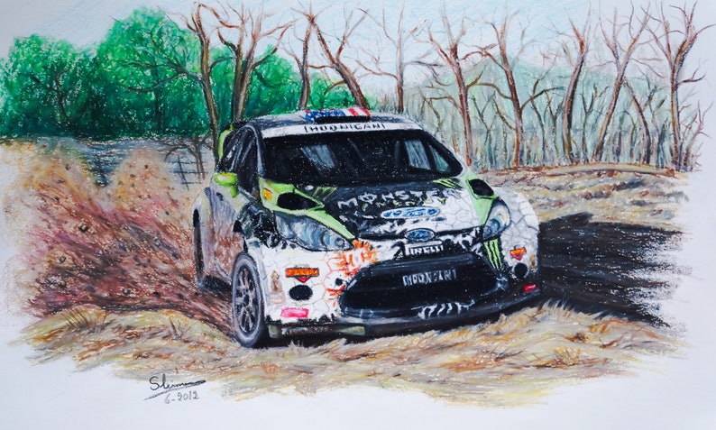 May include: A green and white Ford Fiesta rally car with Monster Energy branding, driving through a dirt road with trees in the background.