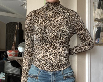 turtleneck cheetah print shirt
