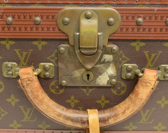 Suitcase Louis Vuitton Alzer 60 cm - Les Puces de Paris Saint-Ouen