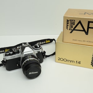 Authentic Nikon FE2 Camera 50mm Lens & Nikkor 200m f/4 Zoom-Nikkor 35~100mm f/3.5~4.5 0p926