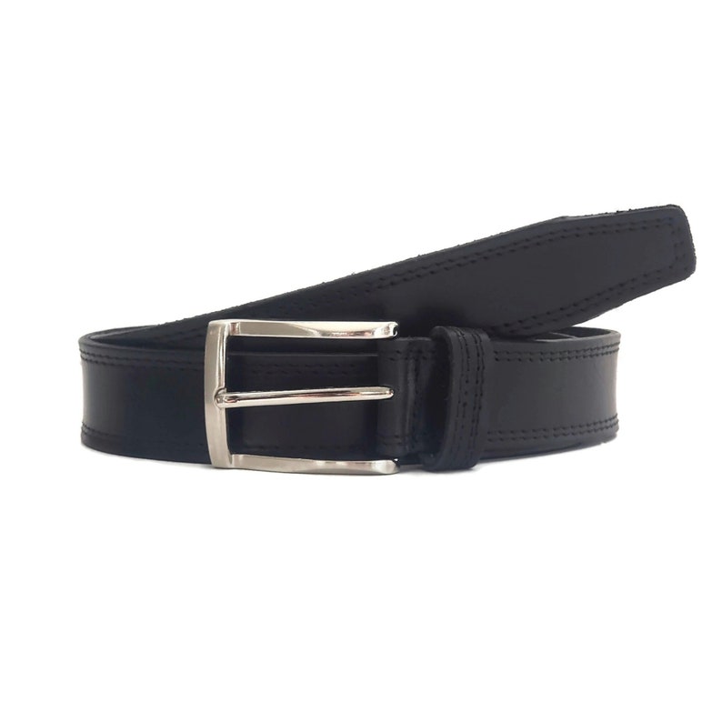 May include: A black leather belt with a silver buckle. The belt has a stitched edge and a smooth finish.