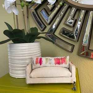 Aurora Sofa: 1 pillow double sided print, 1 seat cushion.