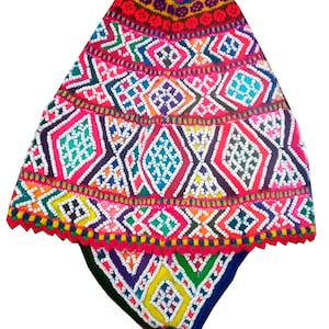 May include: A brightly coloured, hand-knitted hat with a distinctive geometric pattern. The hat features a red top and a multi-coloured design with white, blue, yellow, and green accents. The hat has a tassel at the bottom.