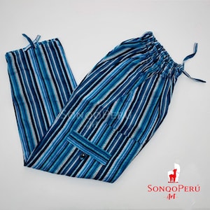 May include: Blue and white striped pants with a drawstring waist and a single cargo pocket. The pants are made of a soft, lightweight fabric.