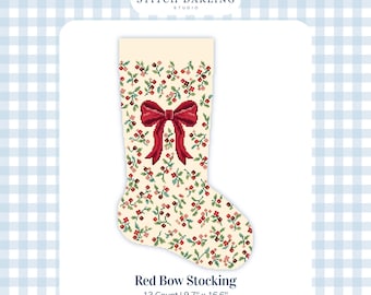 May include: A digital cross stitch chart for a stocking featuring a cream background with a repeating pattern of small red berries and green leaves, centered with a large red bow. The text reads Stitch Darling Studio, Red Bow Stocking, 13 Count | 9.7" x 16.6".