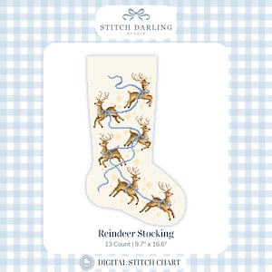 May include: A cream-colored Christmas stocking cross-stitch pattern featuring five brown reindeer connected by a light blue ribbon, accented with small gold stars. The text reads Stitch Darling Studio, Reindeer Stocking, 13 Count, 9.7 inches by 16.6 inches.