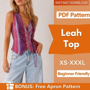 Puede incluir: Un top cruzado sin mangas con un patrón tie-dye vertical en tonos magenta, morado y azul oscuro. La prenda tiene un escote en V y un cierre de lazo lateral. El texto en la imagen incluye: INSTANT DOWNLOAD, PDF Pattern, Leah Top, XS-XXXL, Beginner Friendly, BONUS: Free Apron Pattern.