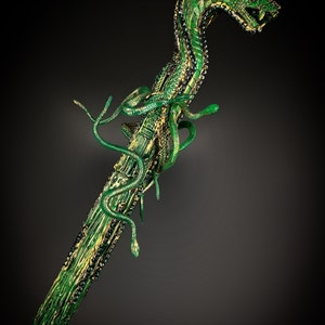 May include: A green snake-shaped walking stick with a detailed, textured surface and gold accents. The snake's head is raised and has a menacing expression.