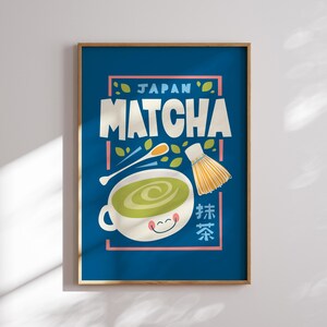 May include: A blue poster with the text "JAPAN MATCHA" in a colorful font. The poster features a cartoon illustration of a bowl of green matcha tea with a whisk and a spoon.