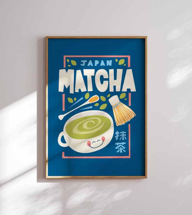 May include: A blue poster with the text "JAPAN MATCHA" in a colorful font. The poster features a cartoon illustration of a bowl of green matcha tea with a whisk and a spoon.