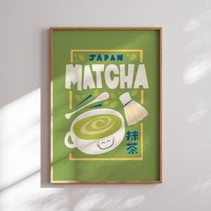 May include: A green poster with a yellow border featuring a cartoon illustration of a bowl of matcha green tea with a whisk and a spoon. The text "JAPAN MATCHA" is in blue and yellow letters. The text "抹茶" is in red and blue letters.