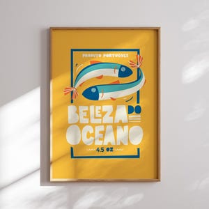 A bright yellow Almanac Co Prints poster featuring two colorful fish with the text "Beleza do Oceano" in bold lettering, Portuguese style.