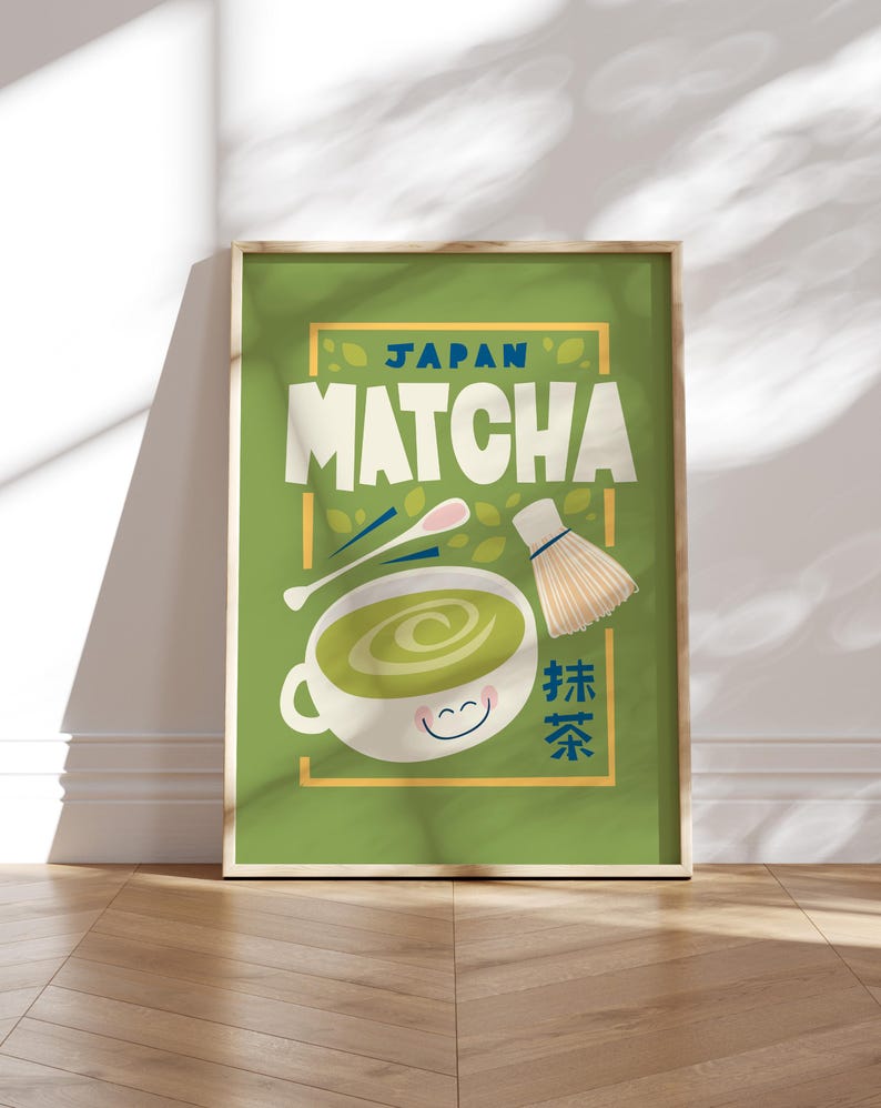 May include: A green poster with a white frame featuring a cartoon illustration of a cup of matcha tea with a smiling face. The text "JAPAN MATCHA" is in a blue font with a yellow outline. The text "抹茶" is in a black font with a white outline.
