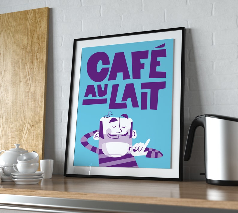 A vibrant "Café au Lait" poster from Almanac Co Prints in blue and purple with a smiling character holding a cup of coffee, perfect for brightening up any space. Print framed in  modern kitchen.