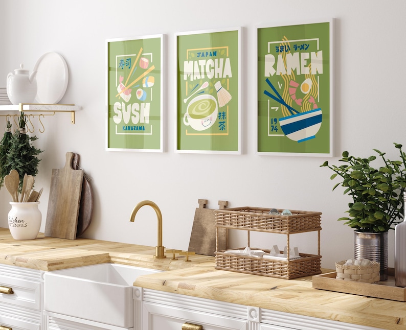 May include: Three framed illustrations of Japanese food and drink. The illustrations are on a green background with white text and images. The first illustration is of sushi with the text "Sushi" and "Kamazama". The second illustration is of matcha with the text "Japan Matcha". The third illustration is of ramen with the text "Umai Ramen" and "Ramen".