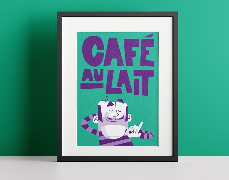Almanac Co Prints framed 'Café au Lait' poster with bold purple text and a cheerful character, set against a green background for fun kitchen decor. Framed against a green wall.