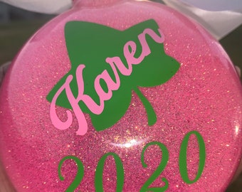 AKA Christmas Ornament (Pink with Green  4 inch disc shaped ornament with glitter)