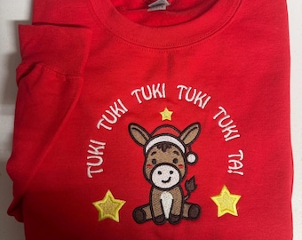 Tuki Tuki Tuki Ta Sudadera de cuello redondo unisex bordada.
