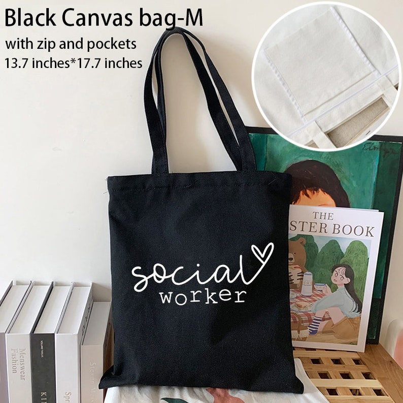 May include: Black canvas tote bag with white text that reads "social worker" and a small heart. The bag has a zipper and pockets and measures 13.7 inches by 17.7 inches.