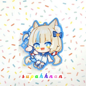 May include: A die-cut sticker featuring a cartoon anime-style character with blonde hair, blue eyes, and a white outfit. The sticker has a blue border and the text "Yo-Ho!" is visible. The sticker is on a background with colorful confetti.