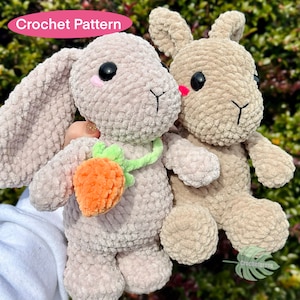 May include: Two crocheted plush bunny toys, one in light gray with an orange carrot and a green leaf, and the other in beige. The caption "Crochet Pattern" is visible in the top left corner of the image.