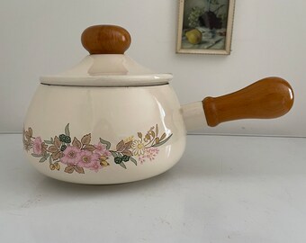 Enamelled pot with wooden handle and floral decoration