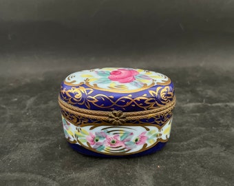 Hand painted porcelain pill box with flowers