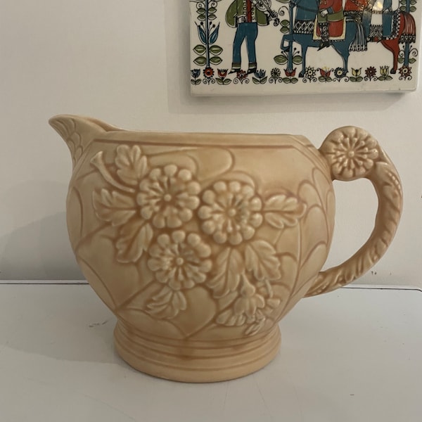 Large Arthur Wood ceramic jug with flower pattern.