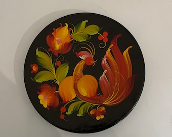 Brightly coloured hand painted lacquered plate of a cockerel