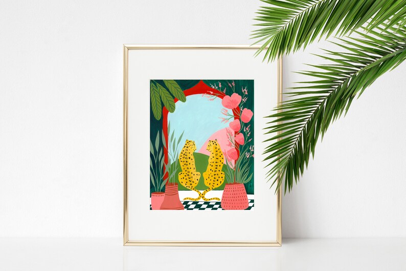 May include: A framed illustration of two leopards sitting back to back in front of a colorful archway with pink flowers and green plants. The leopards are facing each other and the archway is open to a blue sky with pink clouds.