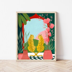 May include: Two yellow leopards with black spots sit facing each other in front of a red and green archway with pink flowers. The archway is framed by a wooden frame.