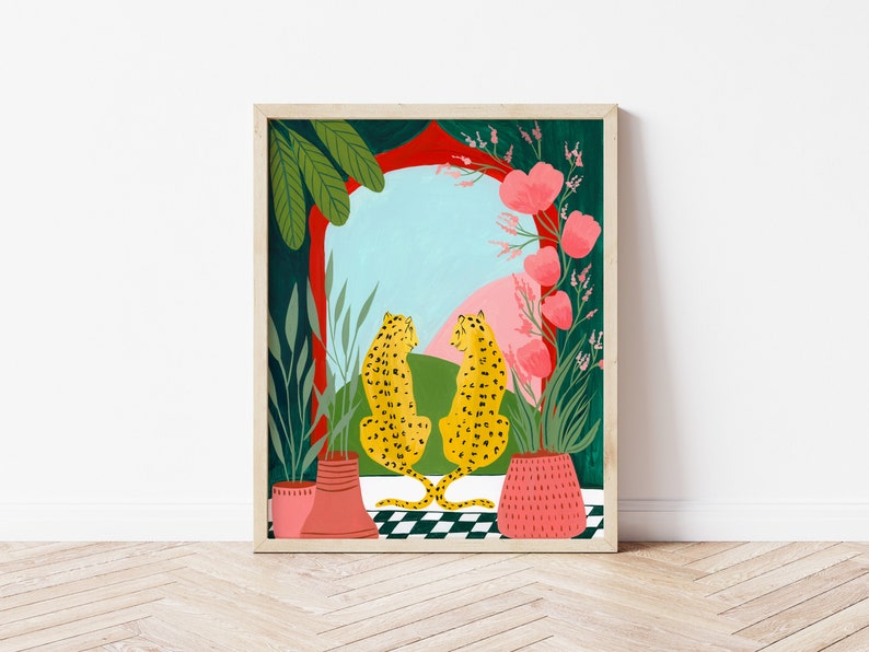 May include: Two yellow leopards with black spots sit facing each other in front of a red and green archway with pink flowers. The archway is framed by a wooden frame.