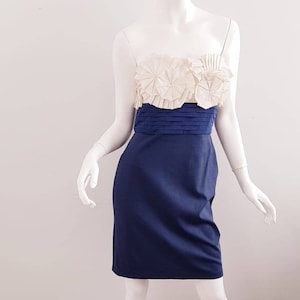 A little Back To The Early 2000s BCBG's Solid Strapless Flower Ruffle Top w/Tight Waist Belt And Stretchy Bottom T o Make That Perfect Dress