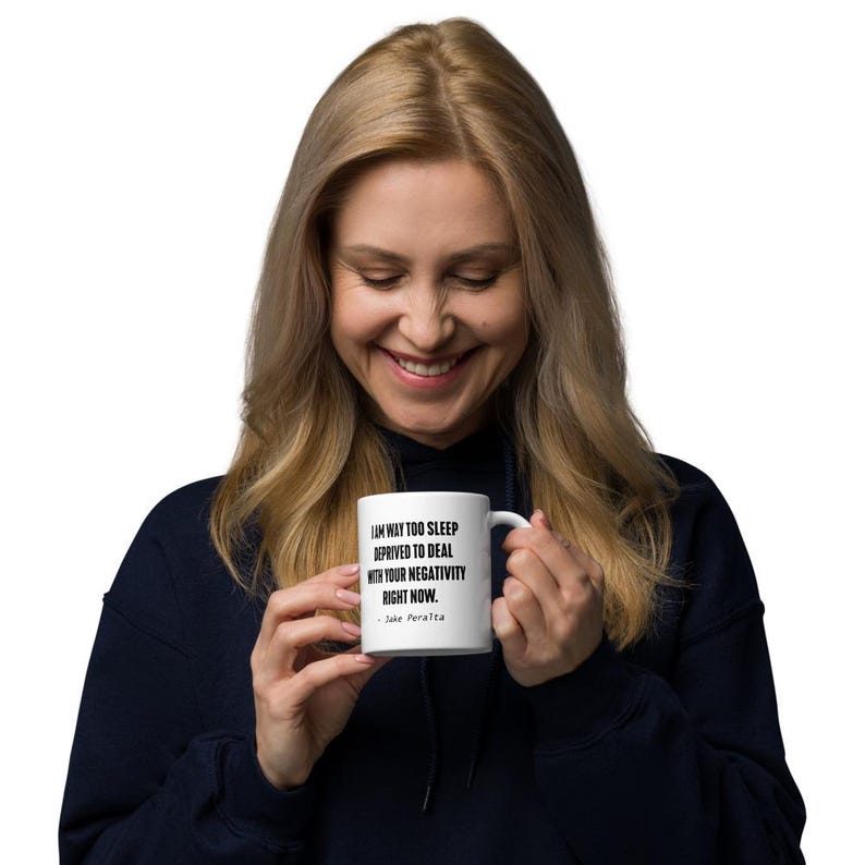 May include: White ceramic mug with a black quote that reads "I am way too sleep deprived to deal with your negativity right now. - Jake Peralta"