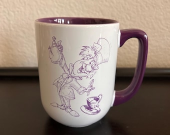 Disney Parks Alice in Wondeland Mad Hatter We Are All Mad Here purple mug 16 oz