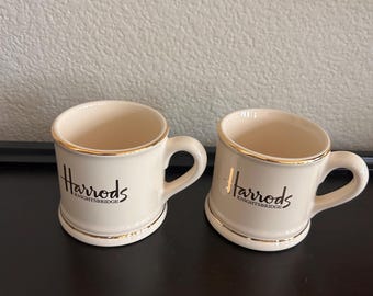 Two vintage Harrods Knightsbridge mugs ivory-glazed fine bone china gold edge