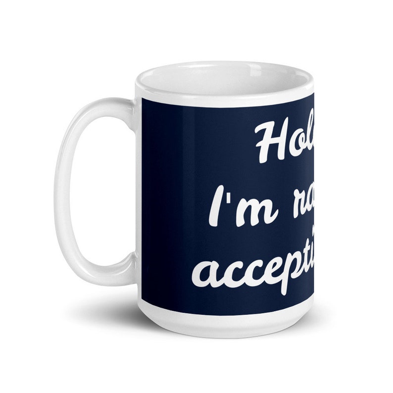 May include: White ceramic mug with a navy blue band featuring the text "Hold on, I'm not accepting". The mug has a white handle and is suitable for hot or cold beverages.