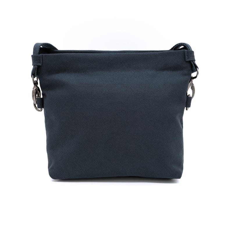 May include: A dark grey canvas crossbody bag with silver hardware and a simple design.