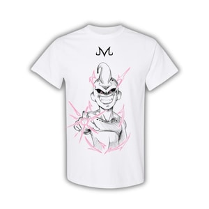 May include: White t-shirt featuring a black and pink graphic of a cartoon character with the letter "M" above the character's head. The character is pointing with a pink energy blast.