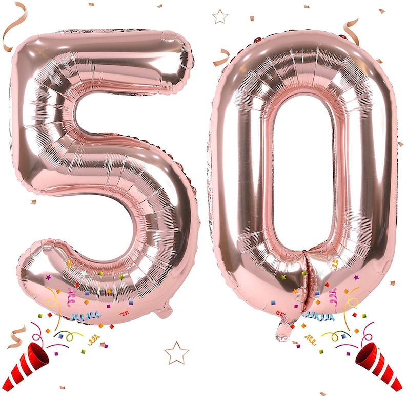 May include: Two large rose gold foil balloons in the shape of the numbers 5 and 0. The balloons are inflated and ready to be used for a party or celebration.