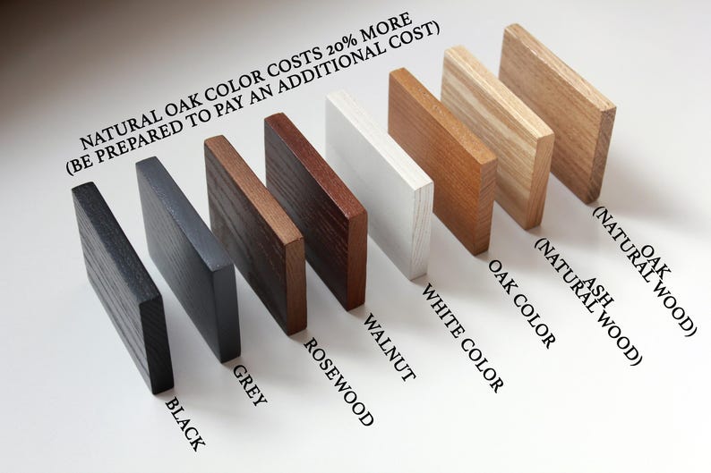 May include: Wood samples in various colors, including black, grey, rosewood, walnut, white, oak, and ash. The text "NATURAL OAK COLOR COSTS 20% MORE (BE PREPARED TO PAY AN ADDITIONAL COST)" is written at the top of the image.