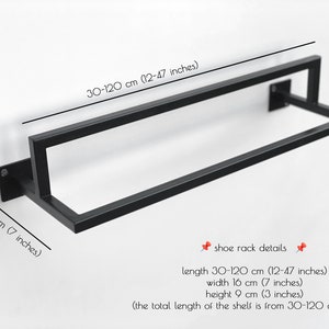 May include: Black metal shoe rack with adjustable length from 12 to 47 inches. The rack is 7 inches wide and 3 inches high.