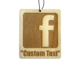 May include: A wooden car air freshener with a brown background and a white "f" in the center. The text "Custom Text" is printed below the "f".