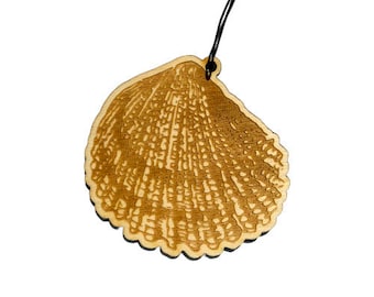 May include: A wooden ornament shaped like a seashell with a detailed laser-cut design. The ornament is light brown and has a black string for hanging.