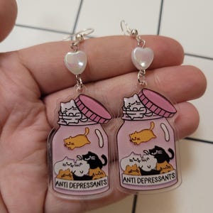 Dingla örhängen med antidepressiva medel mot katt, udda parodismycken för kattälskare, roliga och finurliga accessoarer, unik lekfull present till henne